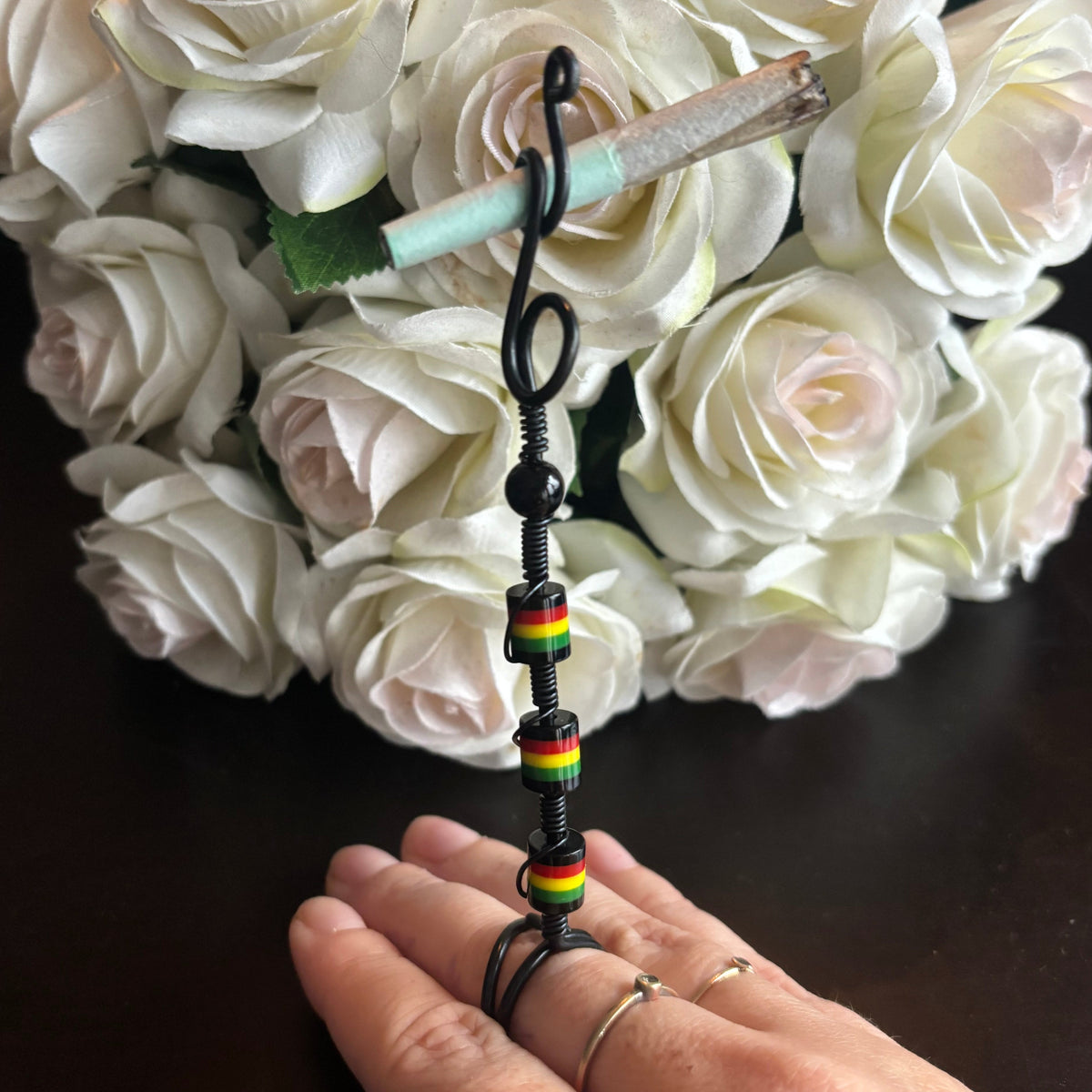 Elegant joint holder smoking accessory with delicate acrylic beading and adjustable ring and joint clasp