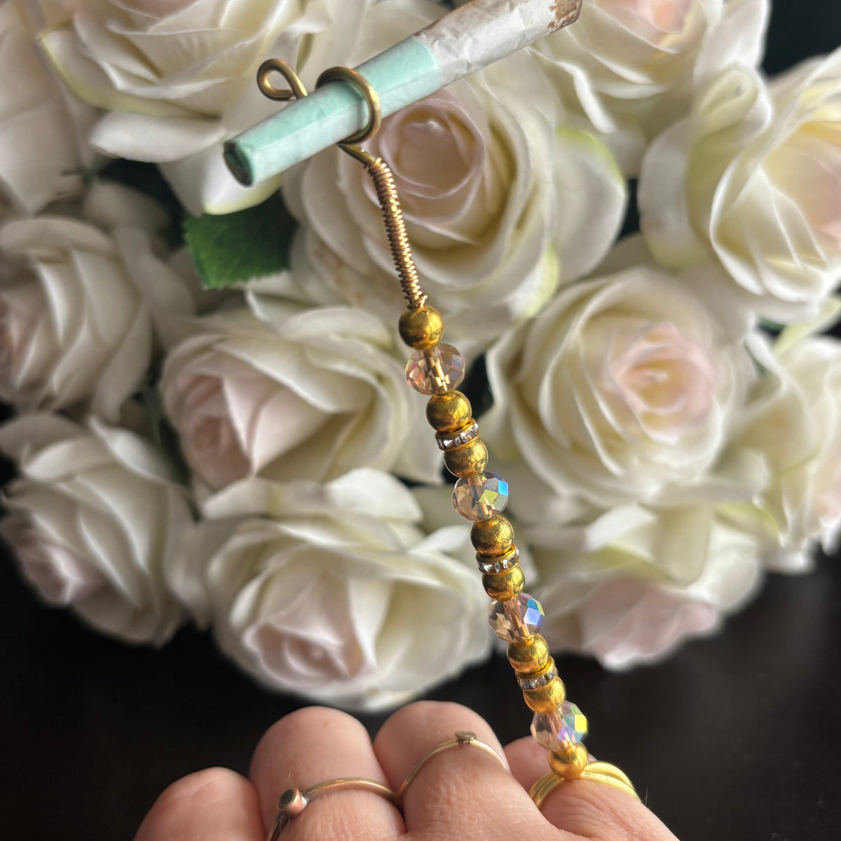 Elegant joint holder smoking accessory with delicate acrylic beading and adjustable ring and joint clasp