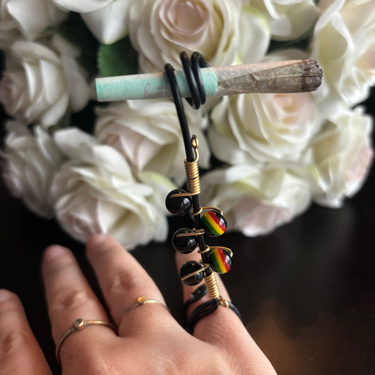Elegant joint holder smoking accessory with delicate acrylic beading and adjustable ring and joint clasp