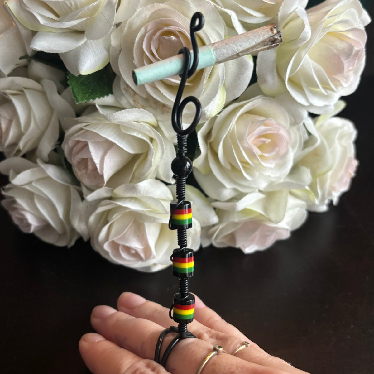Elegant joint holder smoking accessory with delicate acrylic beading and adjustable ring and joint clasp