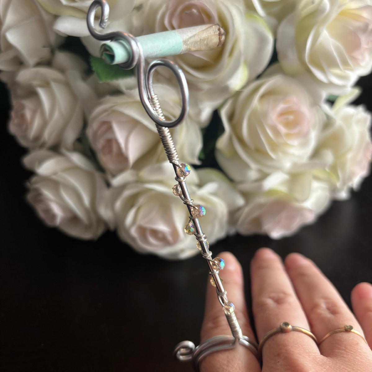 Elegant joint holder smoking accessory with delicate acrylic beading and adjustable ring and joint clasp
