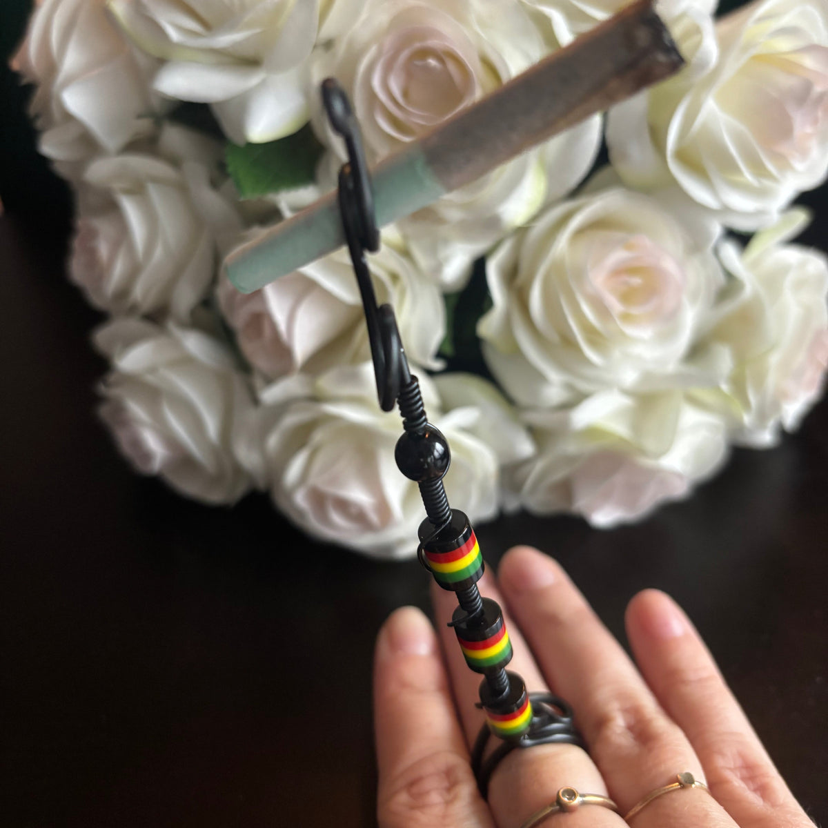 Elegant joint holder smoking accessory with delicate acrylic beading and adjustable ring and joint clasp