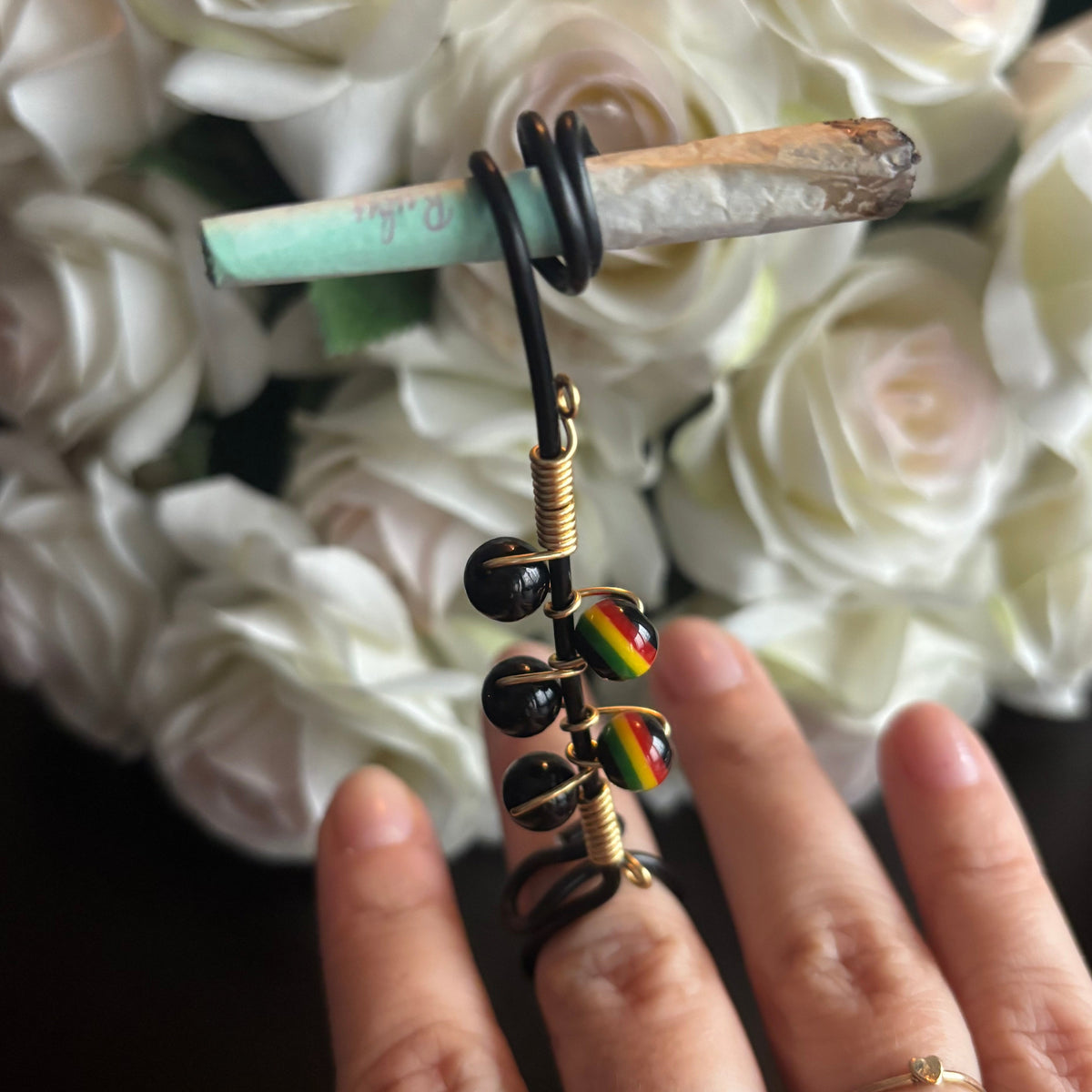 Elegant joint holder smoking accessory with delicate acrylic beading and adjustable ring and joint clasp