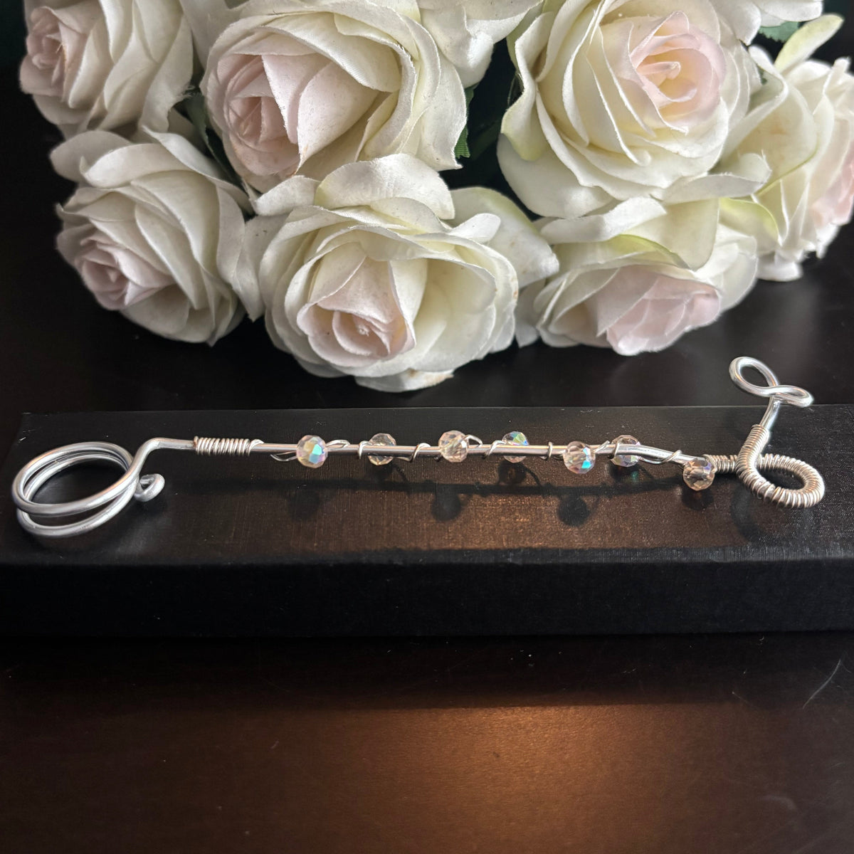 Elegant joint holder smoking accessory with delicate acrylic beading and adjustable ring and joint clasp