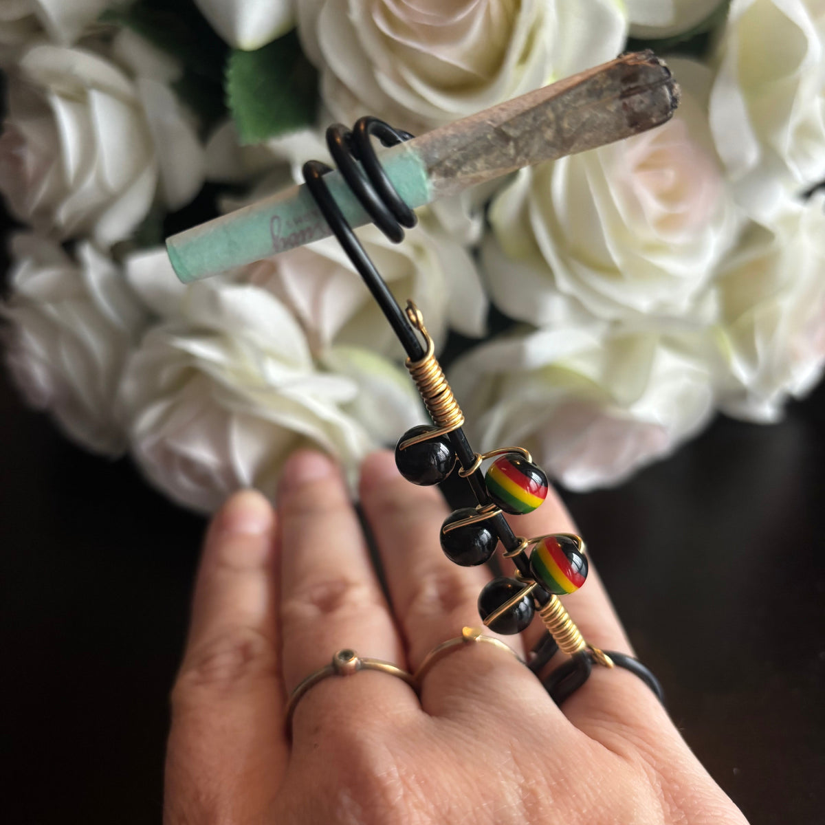 Elegant joint holder smoking accessory with delicate acrylic beading and adjustable ring and joint clasp