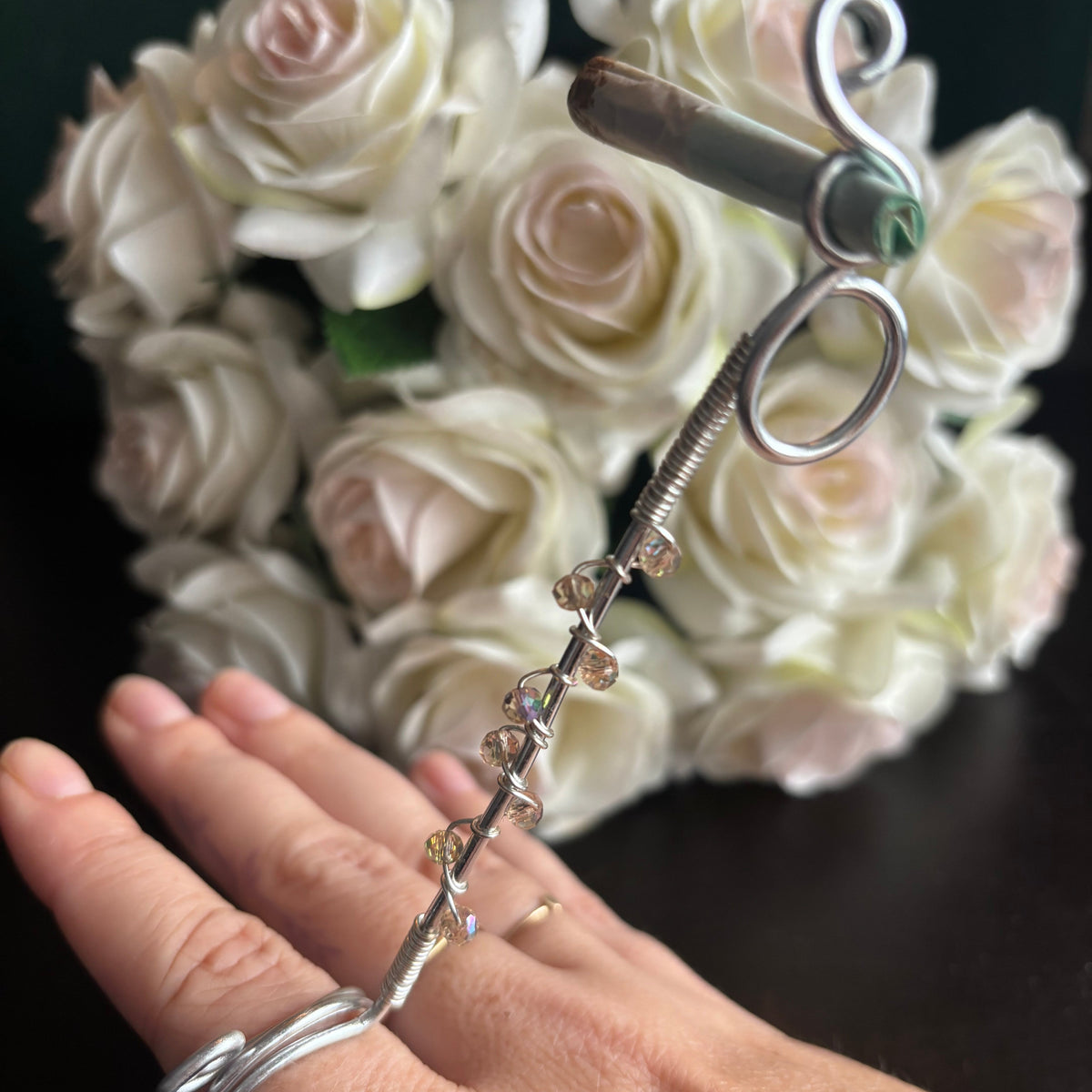 Elegant joint holder smoking accessory with delicate acrylic beading and adjustable ring and joint clasp